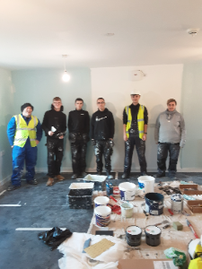 New College Lanarkshire students painting the Amenity House