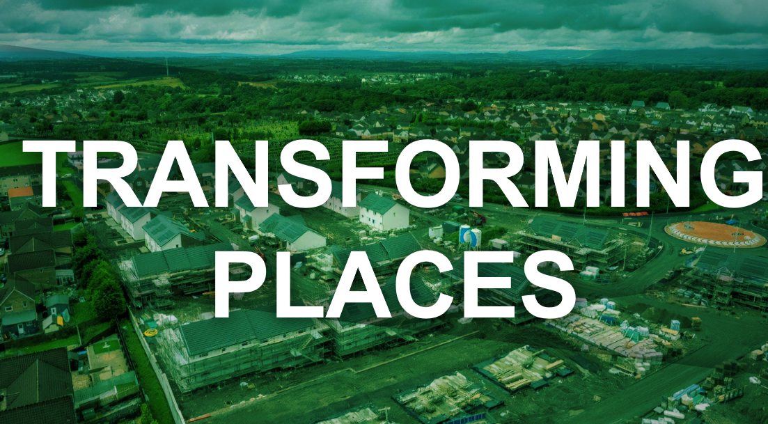 Aerial view of North Lanarkshire with roads, buildings, and green spaces spread across a wide area.