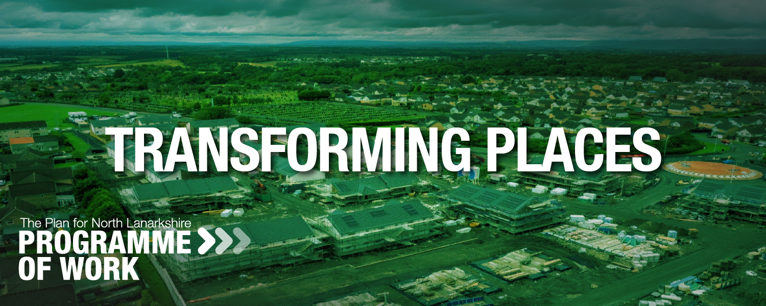 Aerial view of North Lanarkshire with roads, buildings, and green spaces spread across a wide area; with the legend Transforming Places on top.