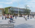 An image of a town with buildings and people cycling
