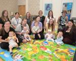 Group of parents and babies at breastfeeding group