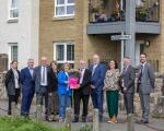 Academy Court new council homes - group with tenant