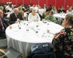 Tenants gathered round a table at our tenant conference