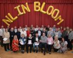 Garden award winners with their trophies