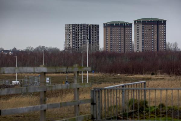 Three tower blocks across a skyline horizon.