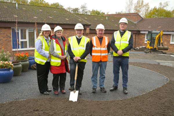 Sod cutting Phyllis Jane Court, Drummond Drive, Wishaw