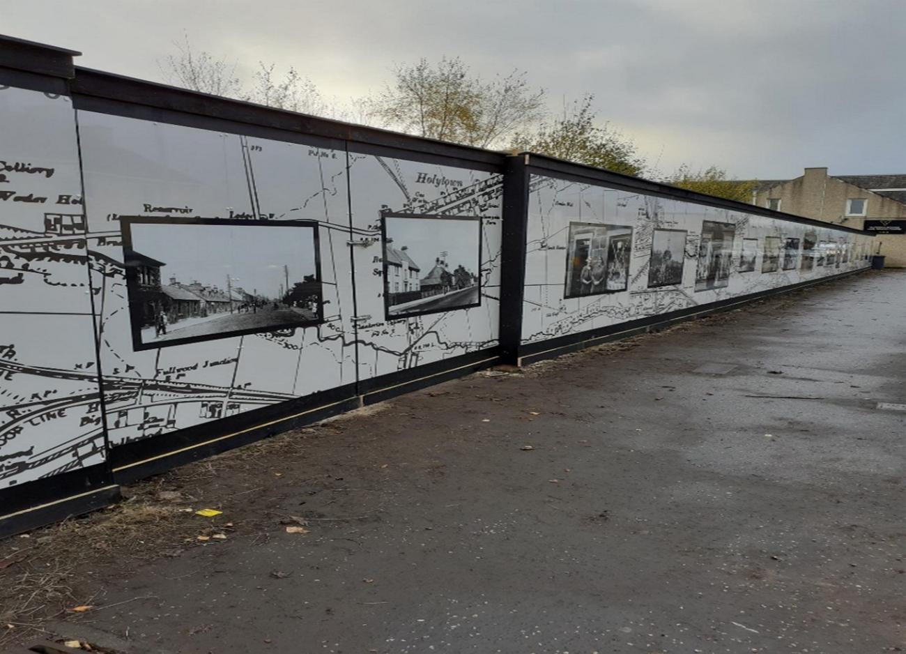High rise fence with heritage photographs