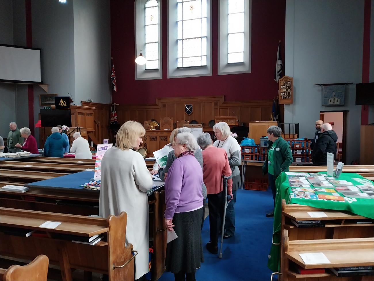 People gathered around socialising. 