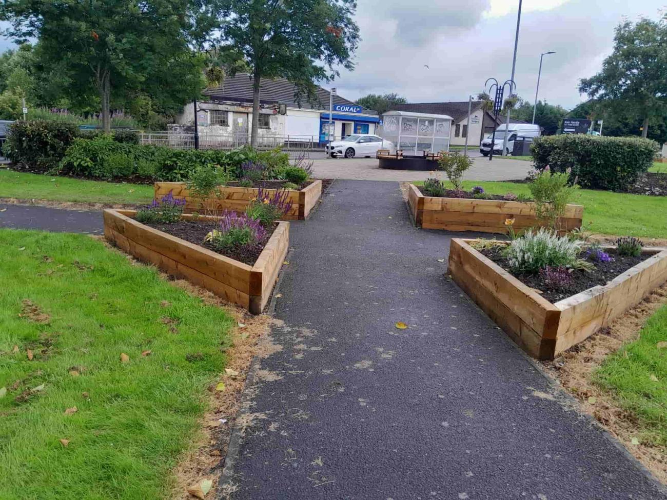 Triangle shaped planters along local pathway