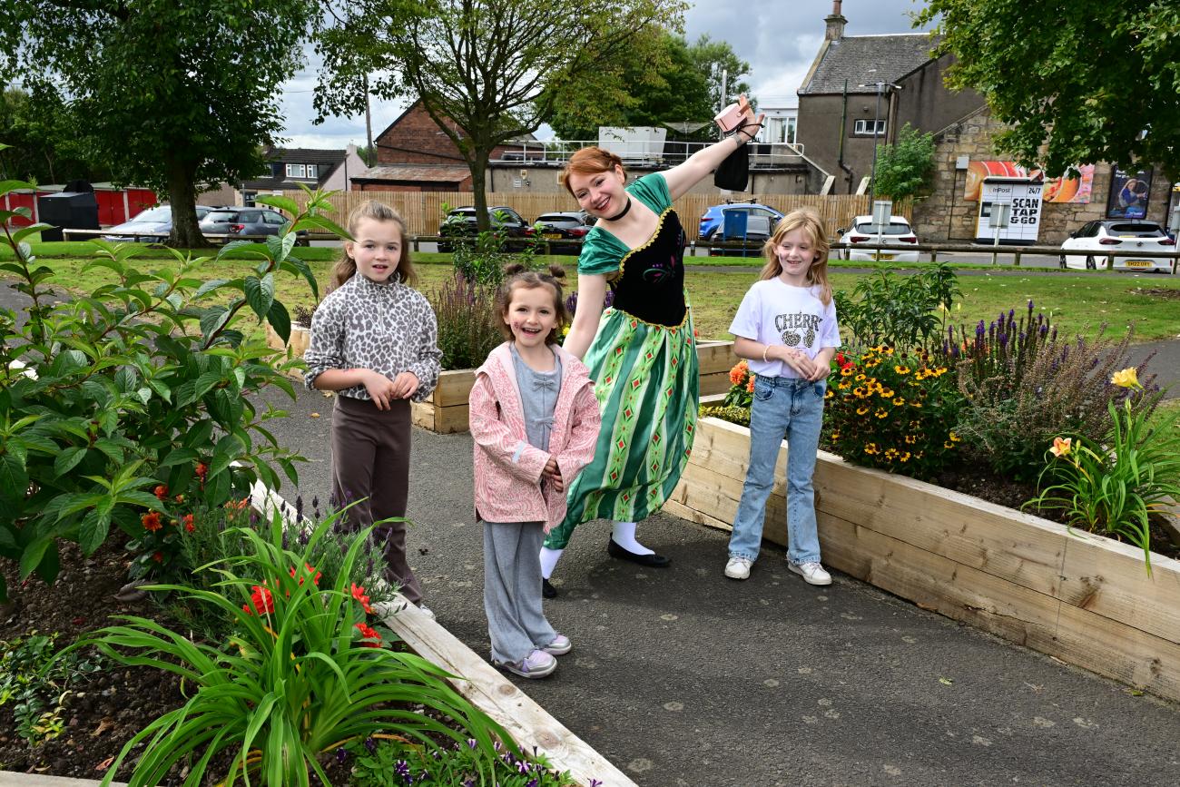 Community members walking around the garden