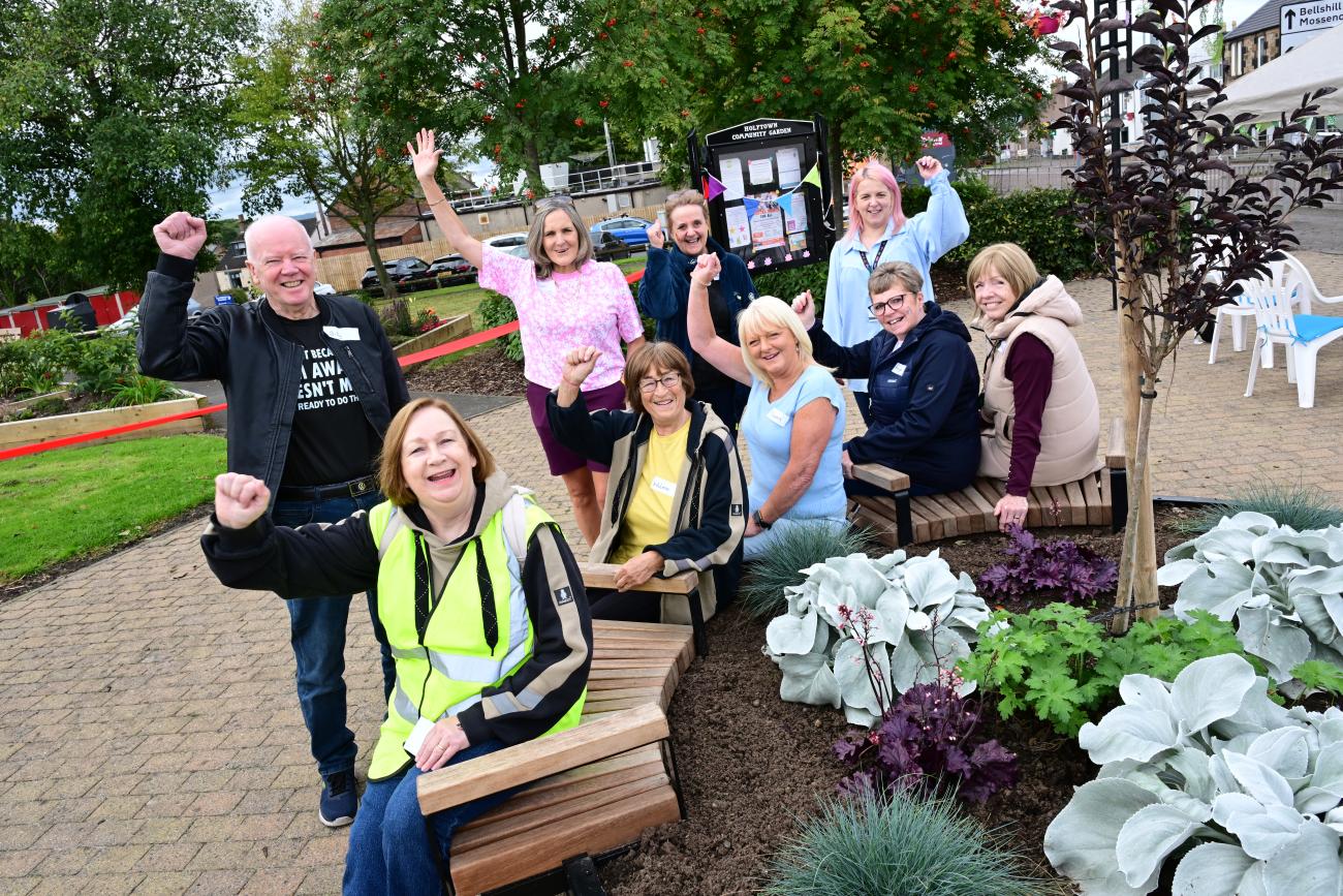 Community members and reps posing for a group photo 