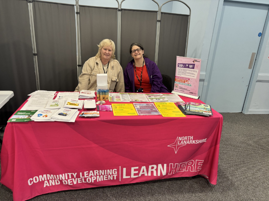 two people overseeing a stall for North Lanarkshire Council 