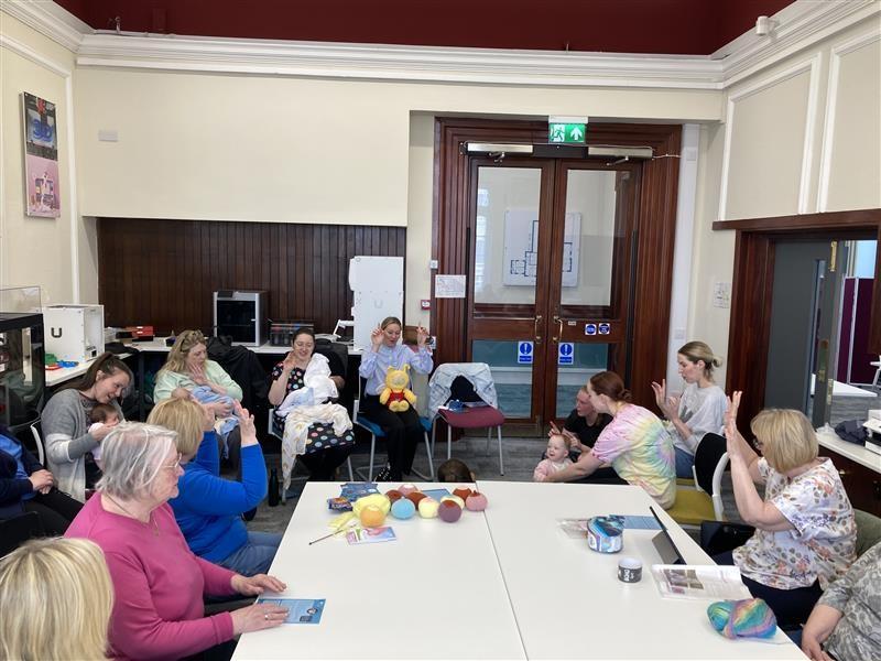 People engaging and talking around a table