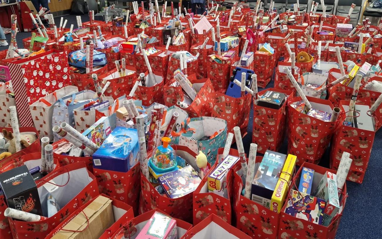 Large amount of chirstmas bags filled with gifts