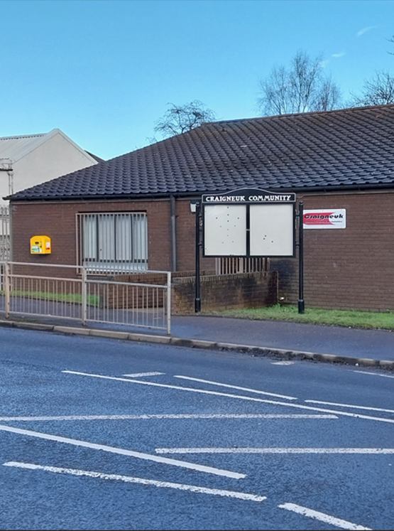 Refurbished noticeboard in front of the Craigneuk Life Long Learning 