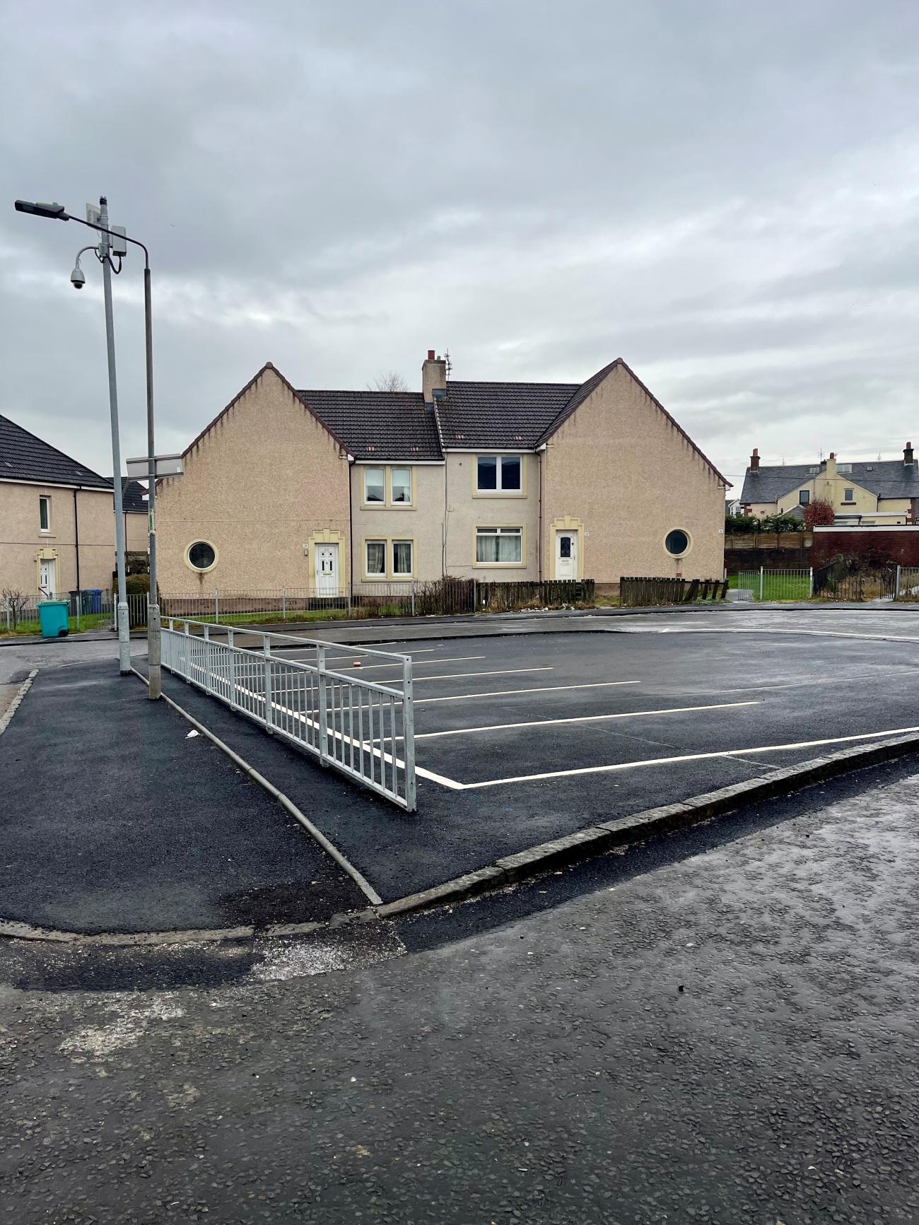 Small grass island has been removed and multiple parking bays installed