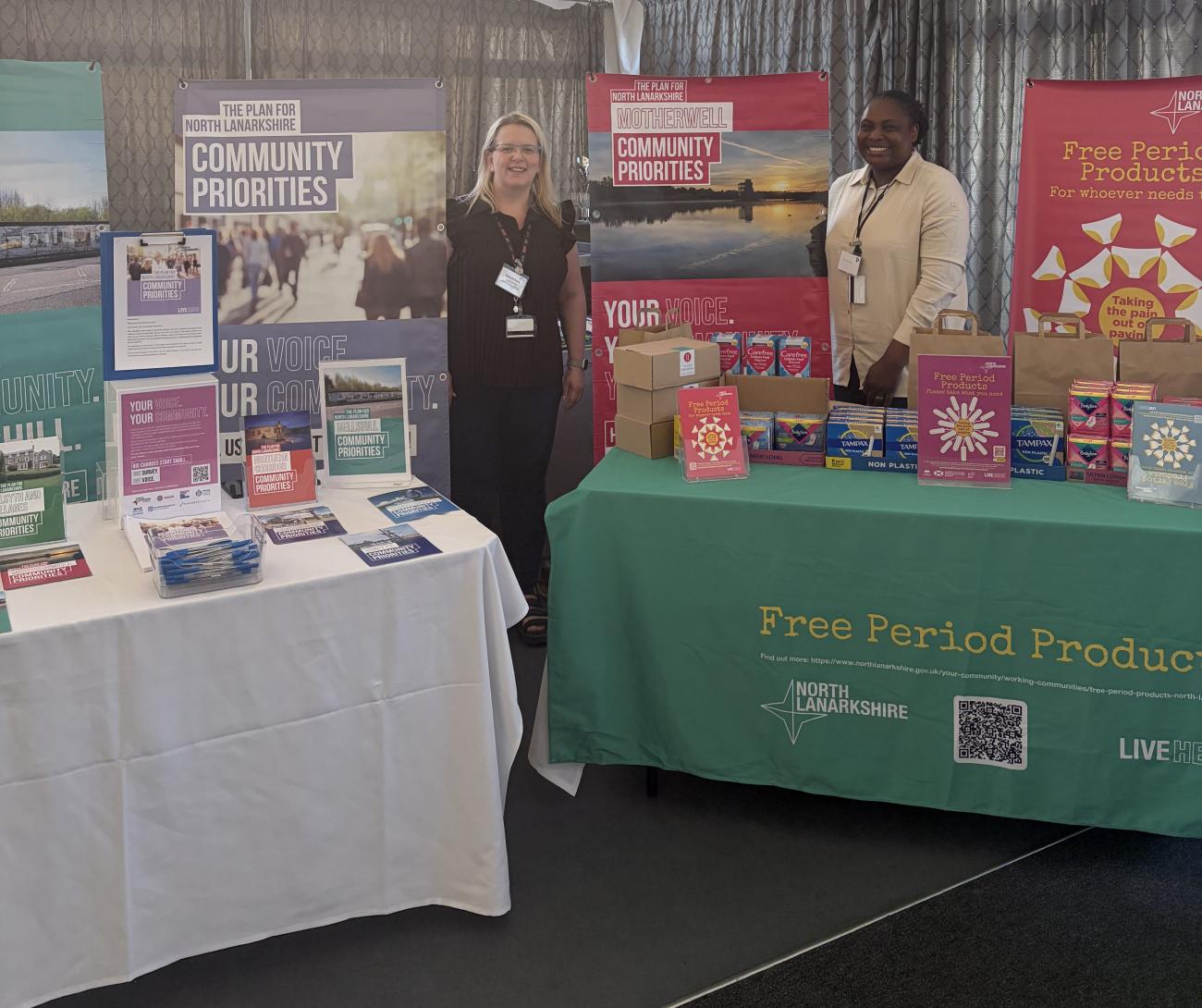 An image of a stall with a council staff member offering access to free period products 