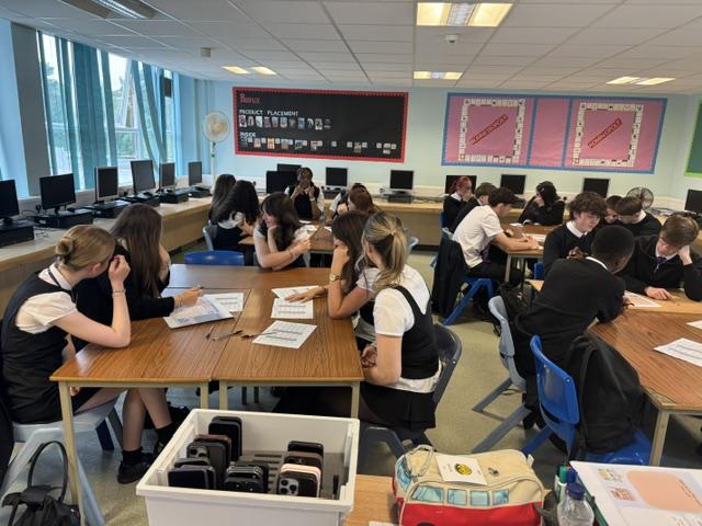 School pupils sitting at desks in a classroom 