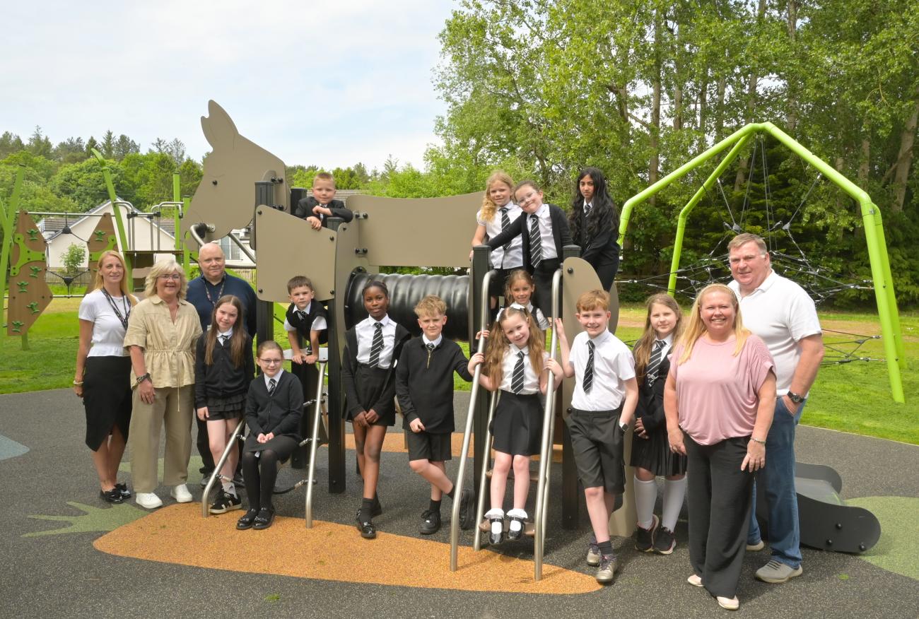 Members of the community, St Ignatius Primary and Council posing in front of new park equipment
