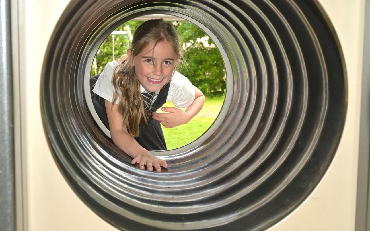 Pupil going through a crawl tunnel 