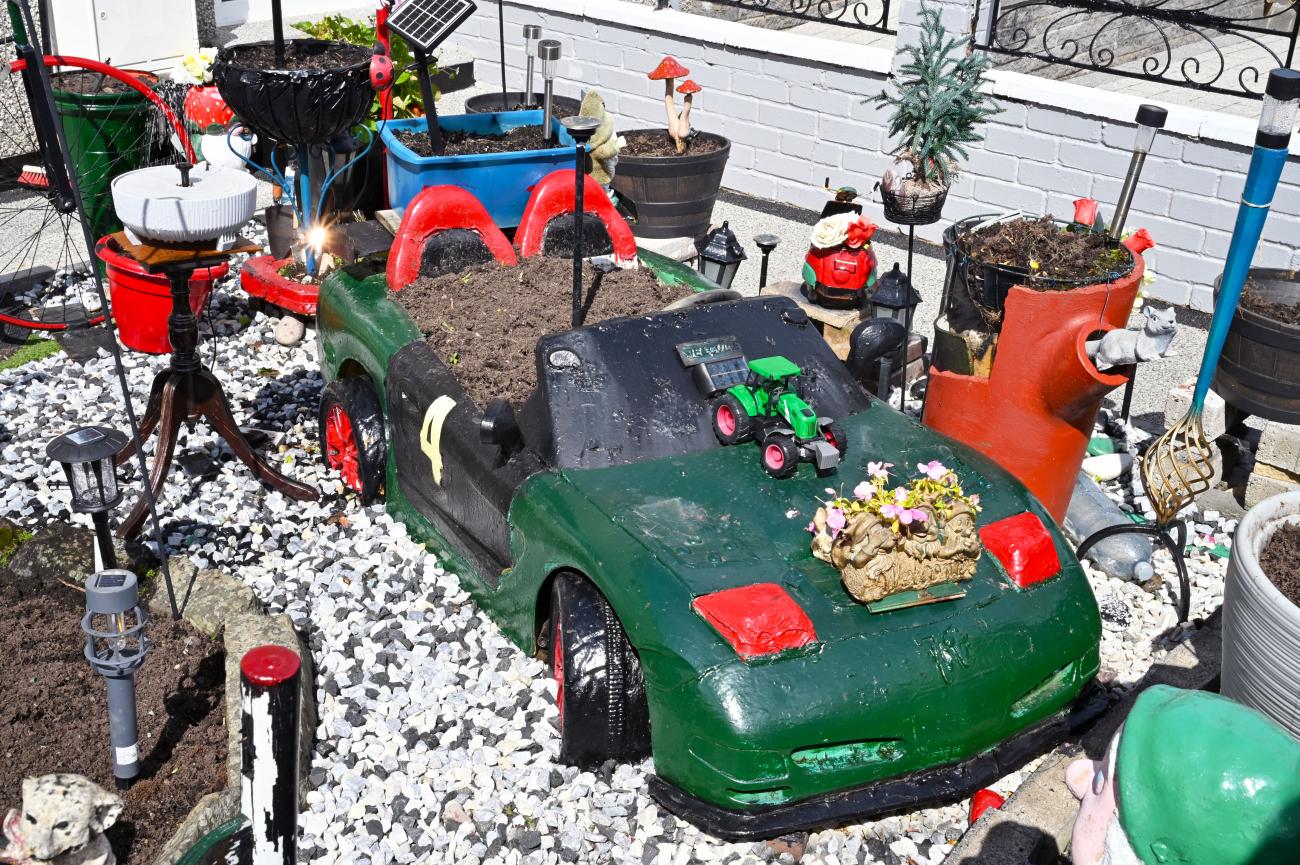 model car as plant bed with flowers