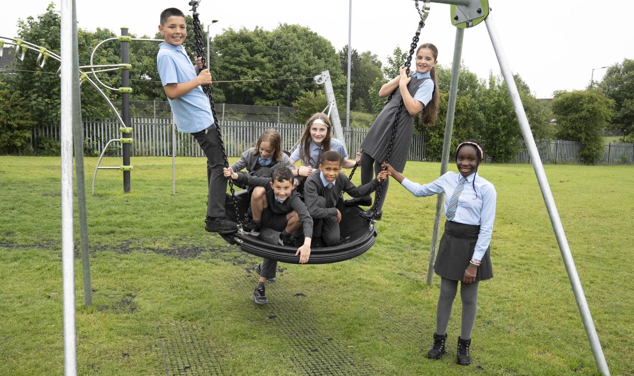 children playing on basket swing