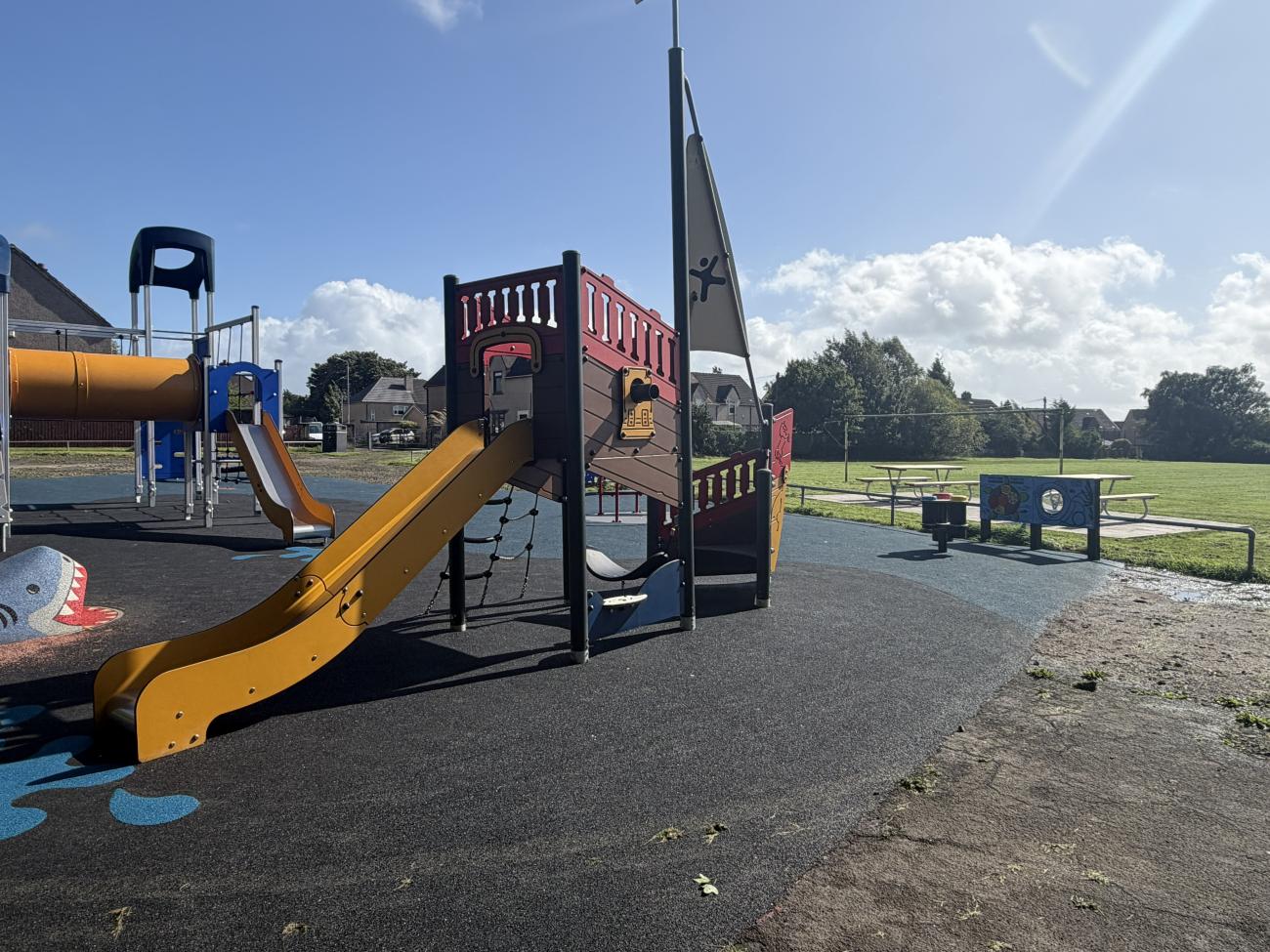 Slide and multi use unit in play area