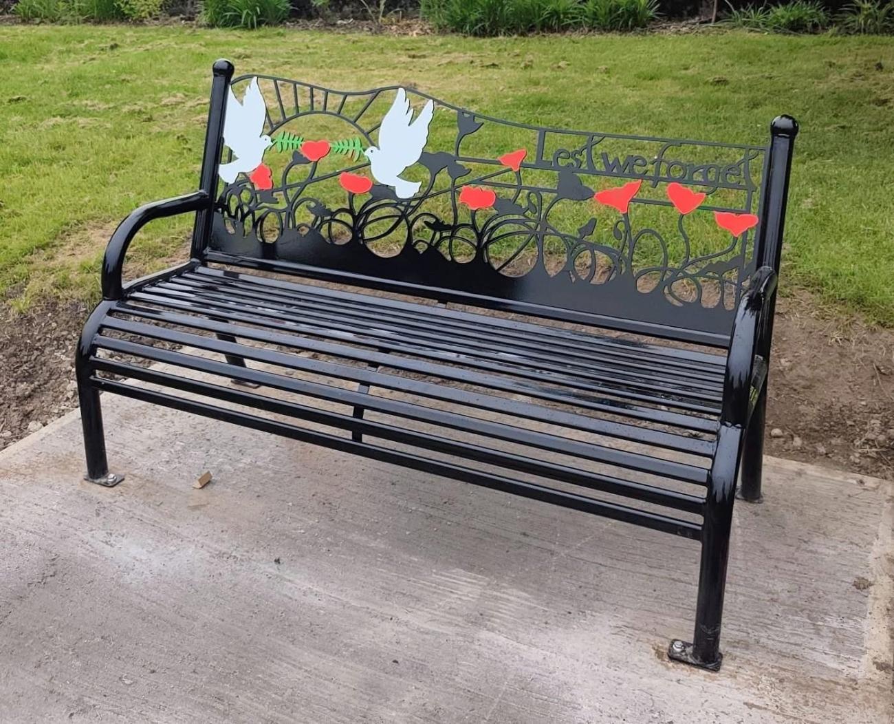 bench in park with poppies